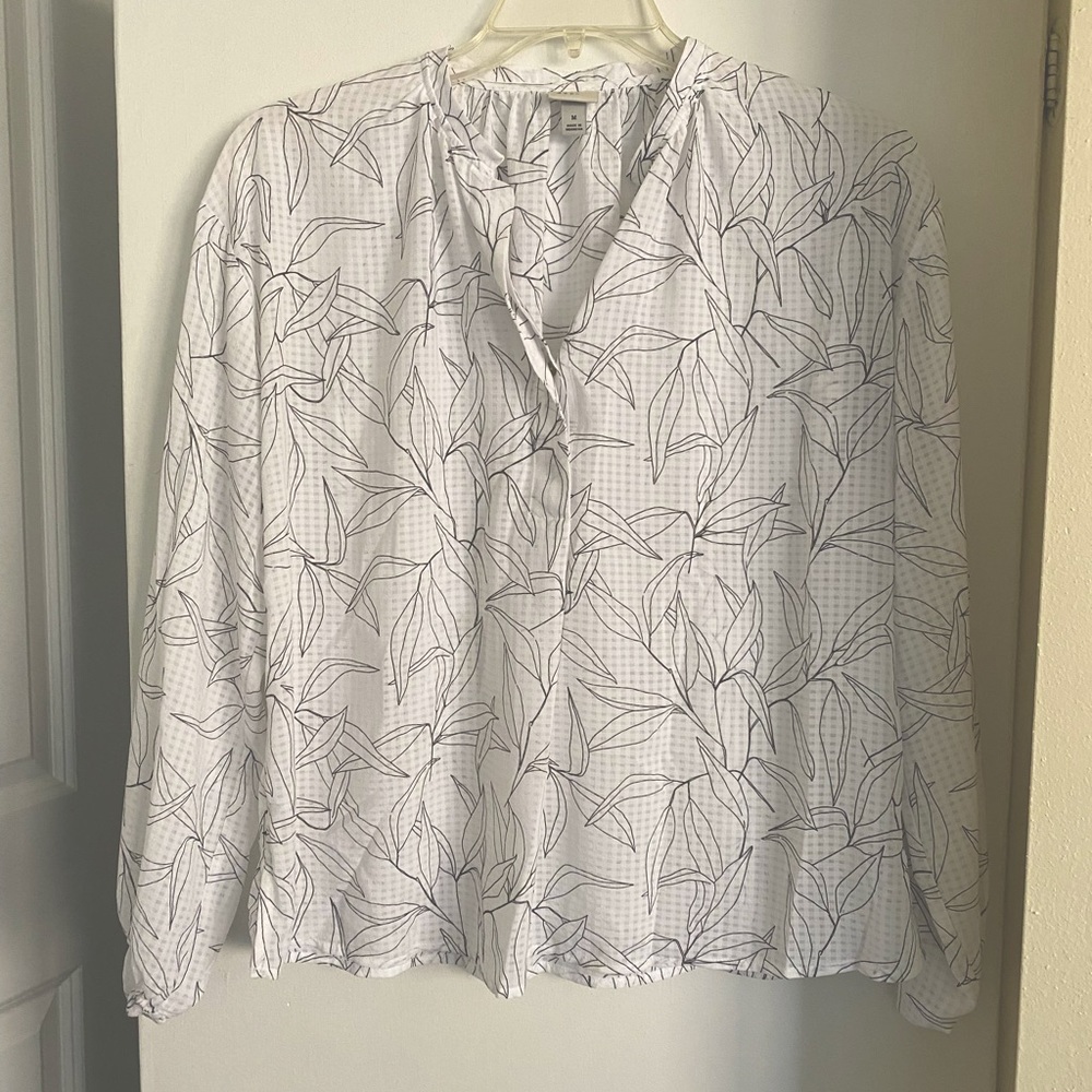 White and black patterned blouse